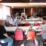 Family dining together in a casual indoor setting.