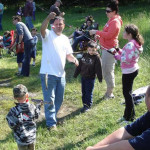 People enjoying a sunny day outdoors in a park.