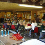 People gathered in a community hall for a meeting or event.