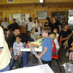 A group of people gathered indoors for a meeting or event.
