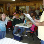 A group of people gathered indoors for a meeting or event.