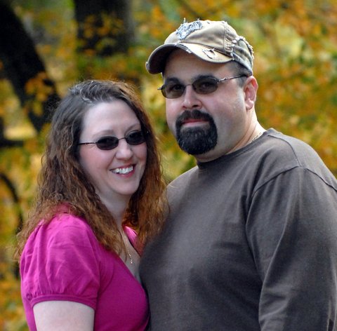 A man and woman posing for the camera.