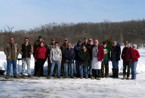 A group of people standing in the snow.