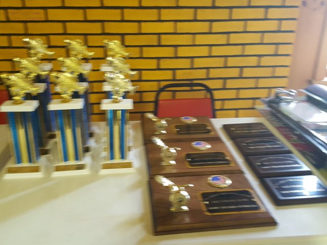 A table with several trophies on it