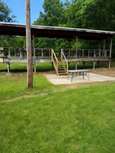 Rustic pavilion in a grassy clearing